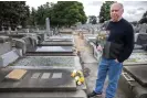  ?? ?? Kam Atkins at his mother Norma Atkins’ grave at Brighton cemetery. Norma died of Covid aged 92. Photograph: Ellen Smith/The Guardian