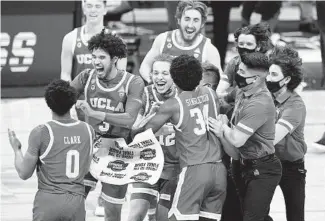  ?? AJ MAST AP ?? UCLA players celebrate after beating Alabama 88-78 in overtime of a Sweet 16 game Sunday.