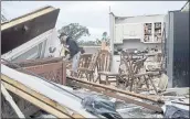  ?? RASHON JORDAN JR. — CHICAGO TRIBUNE rIA AP ?? Nathan Casey, 16, surveys the damage of his home after a tornado swept through the area in soodridge, Ill., Monday.
