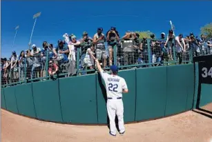  ?? Chris Carlson
Associated Press ?? KERSHAW, SIGNING autographs before a spring training game last month, says if the best baseball players are not as popular as they could be, the sport ought to fix that.