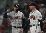  ?? DAVID J. PHILLIP — THE ASSOCIATED PRESS ?? The Houston Astros’ Carlos Correa celebrates his RBI single during the eighth inning in Game 5 of the World Series against the Atlanta Braves on Sunday in Atlanta.