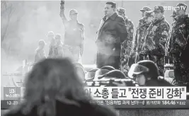  ?? KIM JAE-HWAN SOPA Images/Sipa USA ?? A television in Seoul, South Korea, shows North Korean leader Kim Jong Un, center, at a military training base last month. Kim’s rhetoric has grown aggressive ahead of elections in South Korea. Two prominent analysts wrote an article suggesting that this time Kim isn’t bluffing.