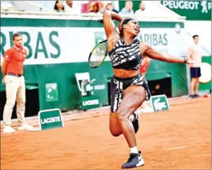  ?? ANNE-CHRISTINE POUJOULAT/AFP ?? Serena Williams returns the ball to Sofia Kenin during their women’s singles third round match at the 2019 French Open in Paris on Saturday.