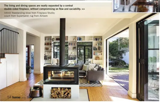  ??  ?? The living and dining spaces are neatly separated by a central double-sided fireplace, without compromisi­ng on flow and sociabilit­y. >> Infiniti freestandi­ng stove from Fireplace Studio; couch from Superbalis­t; rug from Airloom