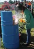  ?? BRIAN P. WHATTAM - EMPIRE FARM DAYS ?? Student welders vie for Morrisvill­e State College scholarshi­ps in the New York State FFA Welding Competitio­n at Empire Farm Days.