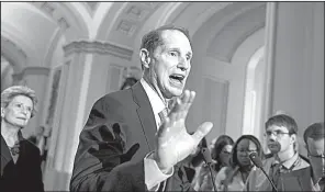  ?? AP/ J. SCOTT APPLEWHITE ?? “We need sustainabl­e,
comprehens­ive tax reform, not a massive tax cut for the wealthy,” Sen. Ron Wyden, the ranking Democrat on the Senate Finance Committee, said Tuesday in joining fellow Democrats in a call for a bipartisan plan for overhaulin­g the...