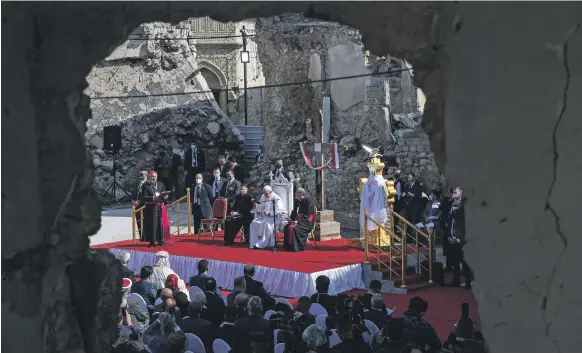  ?? EPA ?? Pope Francis prays for the victims of the war with ISIS during his visit to Church Square in Mosul, where hundreds of people gathered to welcome him