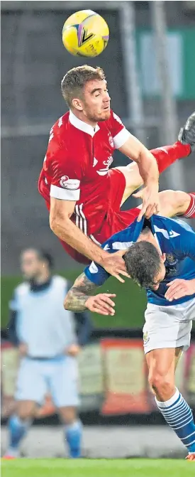  ?? Picture: SNS. ?? Callum Hendry is challenged by Aberdeen’s Tommie Hoban in Thursday’s McDiarmid Park clash. The young Saints striker has struggled for chances so far this season.