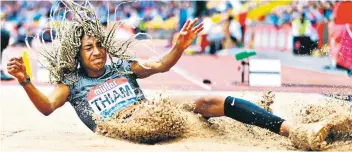  ??  ?? Leap for joy: Nafi Thiam claimed the Belgian long jump record in Birmingham