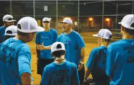  ??  ?? Jon Ferry, one of Silverado’s coaches, talks to players during practice.