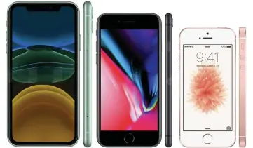  ??  ?? The iPhone 8 (centre) is the same size as the new iPhone SE – much bigger than the old SE (right), but smaller than the iPhone 11 (left)