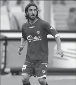  ?? PIERANUNZI LUCIANO/ AFP/ GETTY IMAGES ?? Soccer player Piermario Morosini died of a heart attack on the pitch earlier this year, likely due to an undetected heart defect from birth.