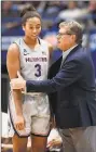  ?? Jessica Hill / Associated Press ?? UConn coach Geno Auriemma, right, talks with Megan Walker during the first half of Tuesday’s win over Virginia in Hartford.