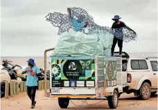  ?? | SHELLEY KJONSTAD African News Agency (ANA) ?? VOLUNTEERS, from left, Odwa Macingwane, Sanele Shusha and Sfiso Luvuno of Green Corridors Litter Boom Project at the clean-up operations on Durban’s beachfront yesterday.