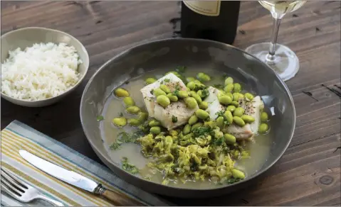  ?? PHOTO PROVIDED ?? This 2018 photo provided by Katie Workman shows a dish of cod, cabbage and edamame taken in New York.