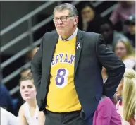  ?? Jessica Hill / Associated Press ?? UConn coach Geno Auriemma wears a jersey honoring late NBA star Kobe Bryant as he watches play from the sideline in February.