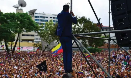  ?? Photograph: Ronaldo Schemidt/AFP/ Getty Images ?? Venezuela’s opposition leader, Juan Guaidó, waves to the crowd during a rally in Caracas in March.