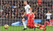  ??  ?? THAT MAN AGAIN: Kane slots home Spurs’ leveller past Ben Foster