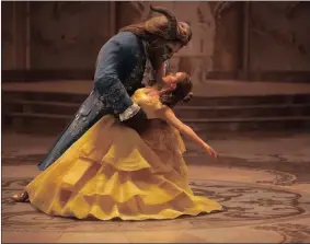  ??  ?? Emma Watson stars as Belle and Dan Stevens as the Beast in Disney’s Beauty and the Beast, a live-action adaptation of the studio’s animated classic directed by Bill Condon.