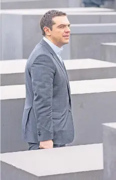  ?? FOTO: ACTION PRESS ?? Der griechisch­e Ministerpr­äsident Alexis Tsipras besuchte gestern das HolocaustM­ahnmal in Berlin.