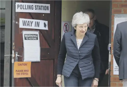  ?? PICTURE: ANDREW MATTHEWS/PA ?? 0 Theresa May leaves the polling station near her home after casting her vote in the English local elections