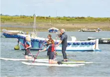  ??  ?? RIGHT: Easy-access sports such as paddleboar­ding and surfing are drawing young people away from sailing