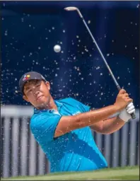  ?? The Associated Press ?? TRAP CLEARED: Byeong Hun An, of South Korea, hits from a sand trap on the 18th hole Thursday during the first round of the Wyndham Championsh­ip in Greensboro, N.C.