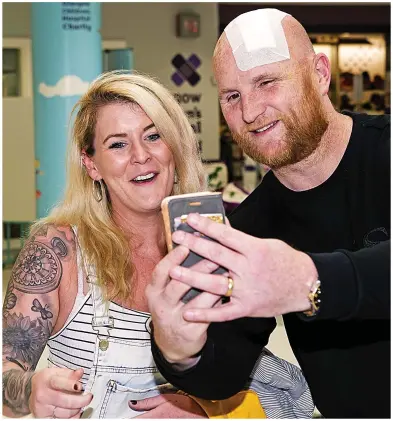  ??  ?? Walking wounded: Hartson was at the Glasgow Children’s Hospital to donate £20,000 just days after needing 48 stitches in his head following a serious golf buggy crash