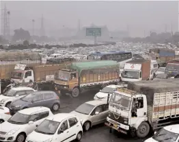  ?? —PTI ?? Vehicles reduced to a crawl after a massive traffic jam at the Delhi-Gurgaon Border on Saturday.