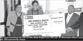  ??  ?? Mrs Laura Gwatiringa (far left) and Mrs Molly Dingani from CBZ with Mr Washington Mbizvo carry the CBZ sponsorshi­p cheque