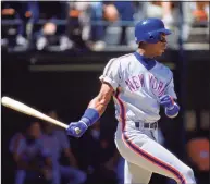  ?? Stephen Dunn / Getty Images ?? The Mets’ Darryl Strawberry swings at the pitch during a game in the 1990.