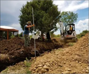  ?? John Miller/Taos News ?? Angelo McHorse, co-owner of Bison Star Naturals, assists a contractor dig at the site where a new production facility will be built. McHorse and his wife, Jacquelene McHorse, are planning to introduce a full suite of body care products to complement their popular soaps.