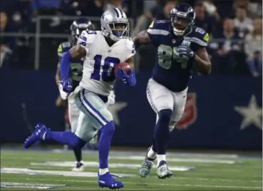  ?? RON JENKINS— THE ASSOCIATED PRESS ?? Cowboys’ Tavon Austin returns a punt for a long gain as the Seahawks’ Ed Dickson gives chase during an NFC wildcard game in Arlington, Texas on Jan 5.