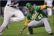 ?? REED HOFFMANN — THE ASSOCIATED PRESS ?? A’s starting pitcher Frankie Montas grabs a grounder to throw out the Royals’ Nicky Lopez at first base during the third inning on Tuesday in Kansas City.