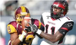  ?? SUN-TIMES FILES ?? Clark Atlanta University’s Trevion Webb makes the catch in front of Central State’s E’Donovan Stewart during the 2016 Chicago Football Classic.