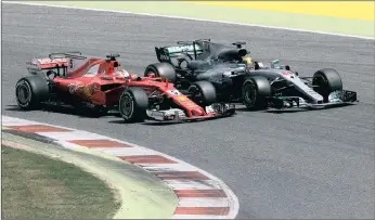  ?? PICTURE: REUTERS ?? Mercedes’ Lewis Hamilton goes neck and neck with Ferrari’s Sebastian Vettel at the Spanish Formula One Grand Prix yesterday. Hamilton took the victory, despite Vettel’s valiant attempts to snatch back the lead.