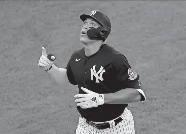  ?? KATHY WILLENS/AP PHOTO ?? New York Yankees outfielder Aaron Judge points skyward after hitting a solo home run during the first inning of an exhibition game against the New York Mets on Sunday at Yankee Stadium in New York.