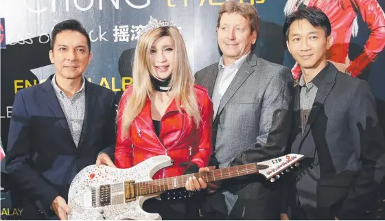  ??  ?? Malaysian transgende­r popstar Jessie Chung (second left) and Gary Scallan (third left), whose company is owed $977,000 by failed Coast business Nature Pacific.