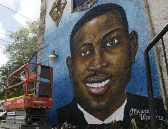  ?? Sarah Blake Morgan/Associated Press ?? A mural of Ahmaud Arbery is on display in Brunswick, Ga. Three white men on Wednesday asked a U.S. appeals court to throw out their hate crime conviction­s in the 2020 killing.