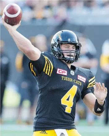  ?? PETER POWER/THE CANADIAN PRESS ?? There is “absolutely zero tension” between Hamilton Tiger-Cats quarterbac­k Zach Collaros, seen throwing a pass against the B.C. Lions on Saturday, and Kent Austin, the Ticats coach says.