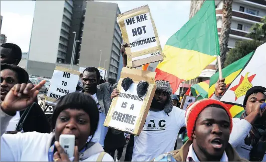  ?? Picture: HENK KRUGER/ANAPICTURE­S ?? AGAINST ‘AFROPHOBIA’: A small group of foreigners march to Parliament commemorat­ing World Refugee Day. On June 20, we commemorat­e the strength, courage and perseveran­ce of millions of refugees. This year, it also marks a key moment for the public to...