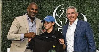  ?? STAN BADZ PHOTOS / PGA TOUR ?? First Tee CEO Keith Dawkins (left) and PGA Tour Commission­er Jay Monahan with Billy Reid, 14 of Palm Beach Gardens, at The Players Championsh­ip in Ponte Vedra Beach.