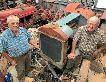  ??  ?? Ian Capstick, left, and David Dench, with a 1924 MccormickD­eering 15-30, one of the tractors in the Dench collection.