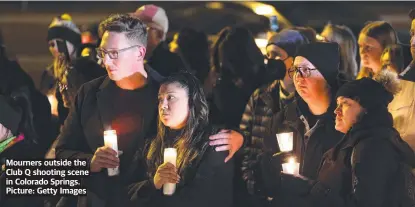  ?? ?? Mourners outside the Club Q shooting scene in Colorado Springs. Picture: Getty Images