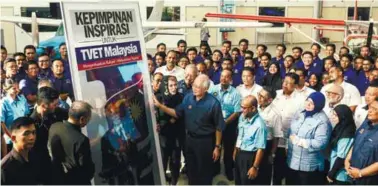 ??  ?? ... Prime Minister Datuk Seri Najib Abdul Razak looks at an exhibit during the rebranding of technical and vocational education and training institutio­ns at the Advanced Technology Training Centre yesterday in Shah Alam, Selangor. The institutio­ns are...