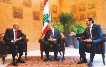  ?? AFP ?? Sa’ad Hariri (right) meets President Michel Aoun and Parliament Speaker Nabih Berri (left) at the presidenti­al palace in Baadba yesterday.