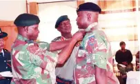  ?? ?? Commander ZNA Lieutenant General Anselem Nhamo Sanyatwe confers new rank to Brigadier-General Chrispen Nduku