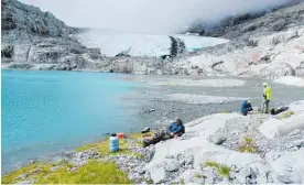  ?? Photo / File ?? Scientists study the Brewster Glacier in Mt Aspiring National Park.