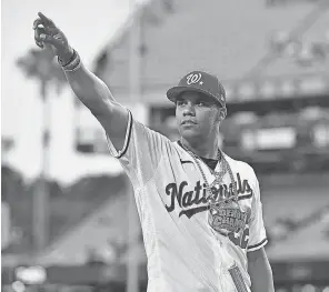  ?? GARY VASQUEZ/ USA TODAY SPORTS ?? Nationals right fielder Juan Soto acknowledg­es the crowd after winning the 2022 Home Run Derby at Dodgers Stadium.