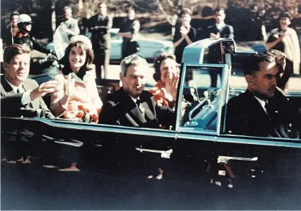  ??  ?? John F. Kennedy ( left) and his wife Jackie travel through Dallas with Governor John Connally and his wife Nellie before the shooting.